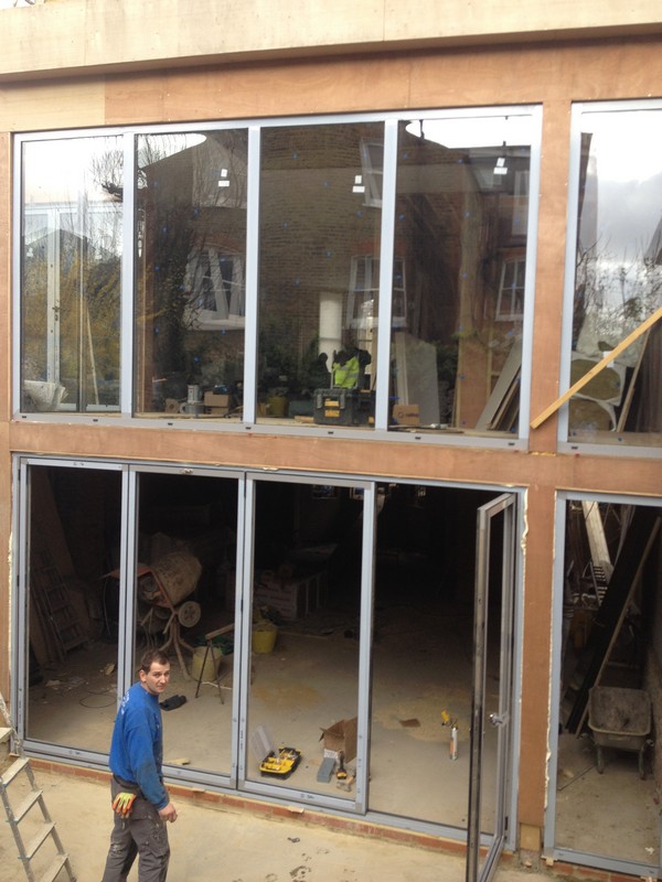 Aluminium bi-fold doors with two-storey glazing in Brockley