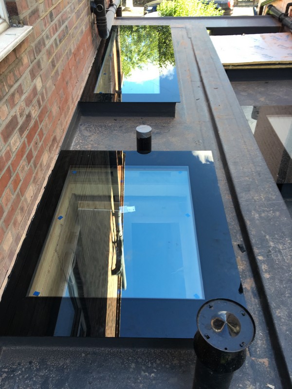 Multiple flat roof skylights on extension in Brockley