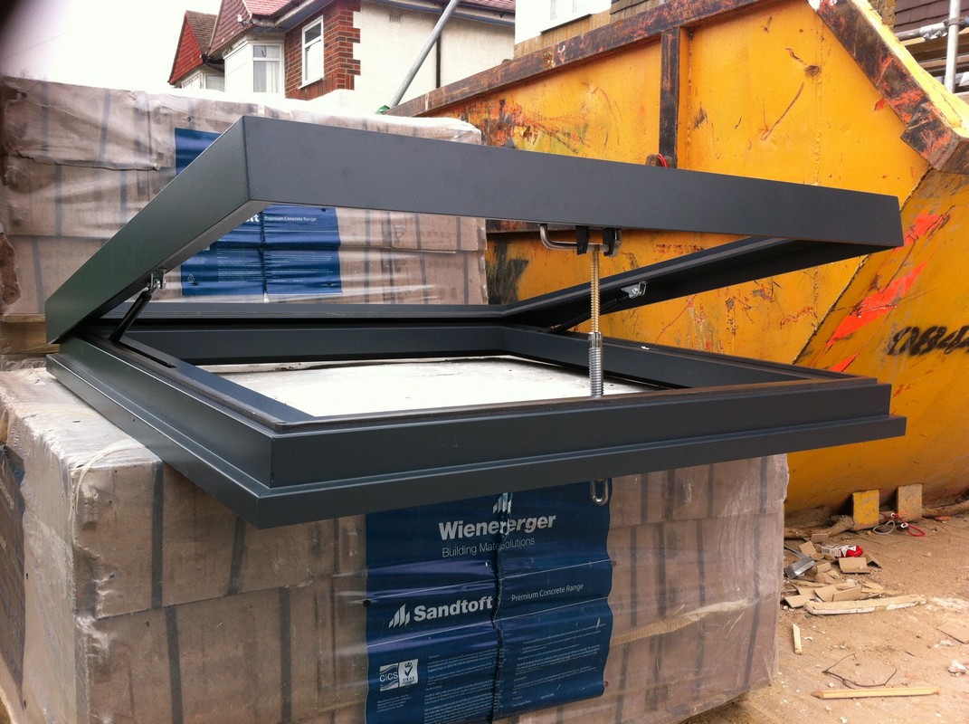 Opening flat roof skylight in anthracite grey installed in Brockley
